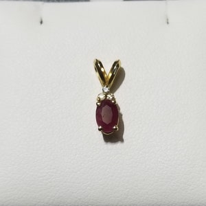 Vintage 14k Yellow Gold oval dark red ruby July birthstone and diamond accent pendant, No Chain