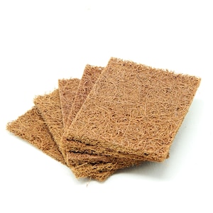 May include: A stack of four brown, rectangular, natural coconut fiber scouring pads. The pads are made of interwoven fibers and have a rough texture.
