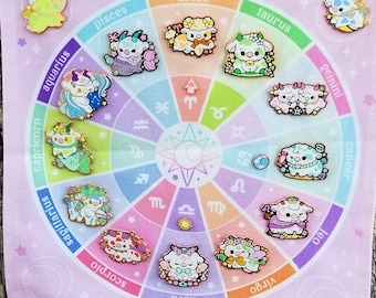May include: A pink fabric banner with a colorful zodiac wheel featuring 12 zodiac signs represented by cute cartoon cows. Each cow is wearing a different outfit and has a different expression. The banner is hanging on a tree trunk.
