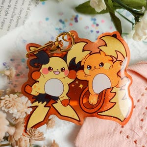 Pokemon Legends Z-A – Mega Raichu X und Y Emaille Pin - Acryl Schlüsselanhänger