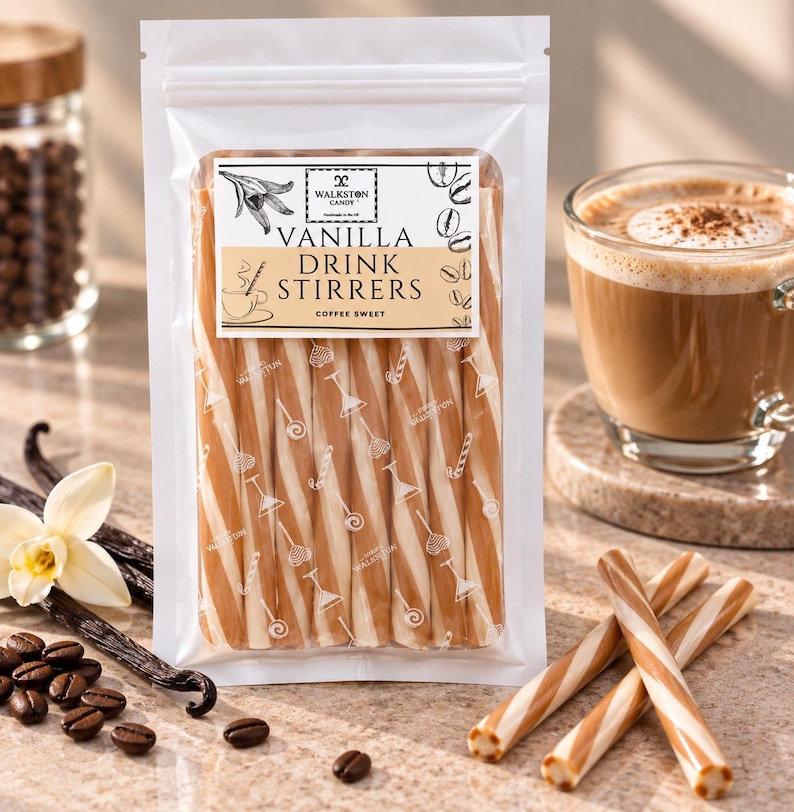 May include: A clear plastic pouch containing six long, cylindrical vanilla drink stirrers with a tan and white spiral pattern. The label reads WALKSTON CANDY VANILLA DRINK STIRRERS COFFEE SWEET, featuring illustrations of a vanilla flower, coffee beans, and a cup.