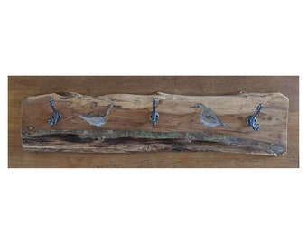 Large coat rack with cast iron hooks on reclaimed and repurposed yew