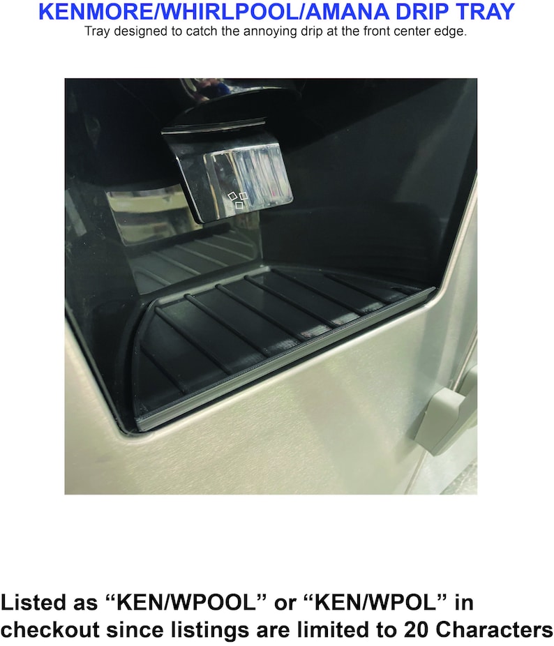 May include: A close-up of a stainless steel refrigerator water dispenser with a black drip tray. The tray is designed to catch water drips from the dispenser.