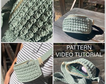 May include: A green crocheted fanny pack with a zipper closure and a long adjustable strap. The fanny pack is shown being worn by a person and also laid flat on a wooden surface. The text "PATTERN VIDEO TUTORIAL" is visible in the image.