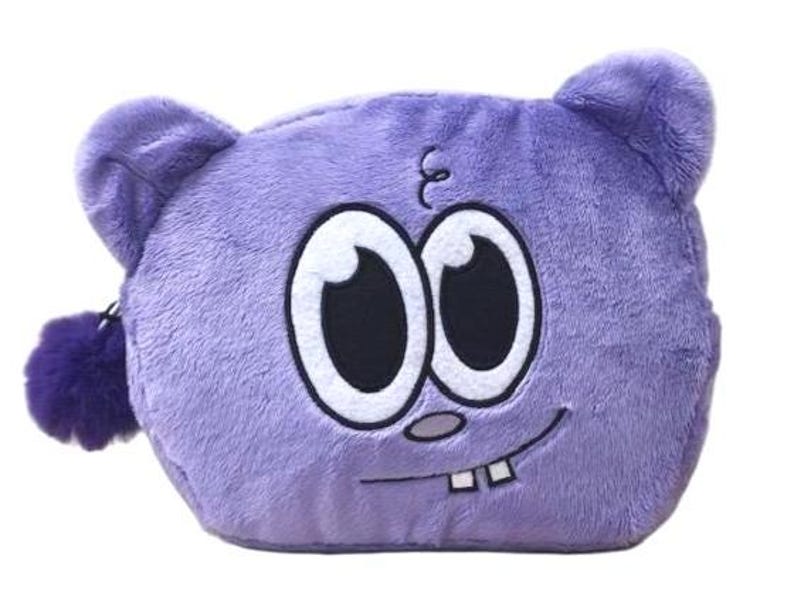Op de afbeelding: Een pluche paars etui met rits in de vorm van een cartoon-karakterhoofd met twee ronde oren. Het gezicht heeft grote witte ogen met zwarte pupillen, een kleine grijze neus en een glimlachende mond die twee witte tanden laat zien.