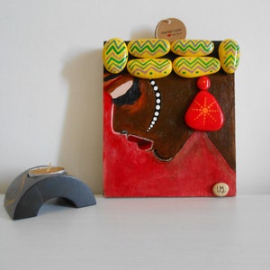Painted stones, pebble art, painted wood, African woman painting