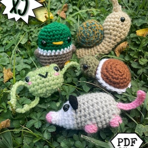 May include: A set of five crochet animal amigurumi patterns, including a duck, snail, frog, turtle, and opossum. The patterns are available as a PDF download. The text "x5 PDF Pattern Bundle" is visible in the image.