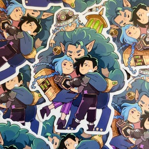 May include: A selection of vibrant stickers showcasing cartoon characters. The characters have blue, black, and purple hair, and are dressed in blue, purple, and gold outfits. These stickers are likely aimed at fans of a video game or animated series.