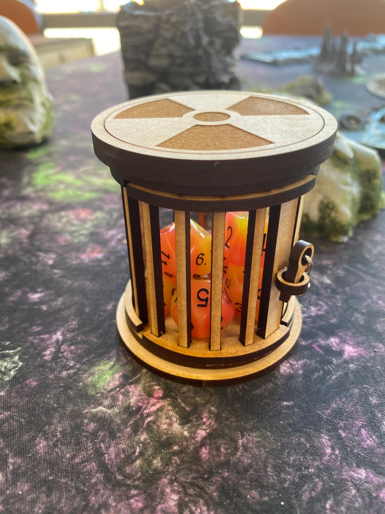 RADIOACTIVE Dice Jail with 7 piece polyhedral dice set