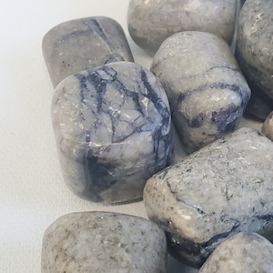 Opalized Fluorite is a rare and captivating stone that combines the vibrant colors of Opal with the clarity of Fluorite.