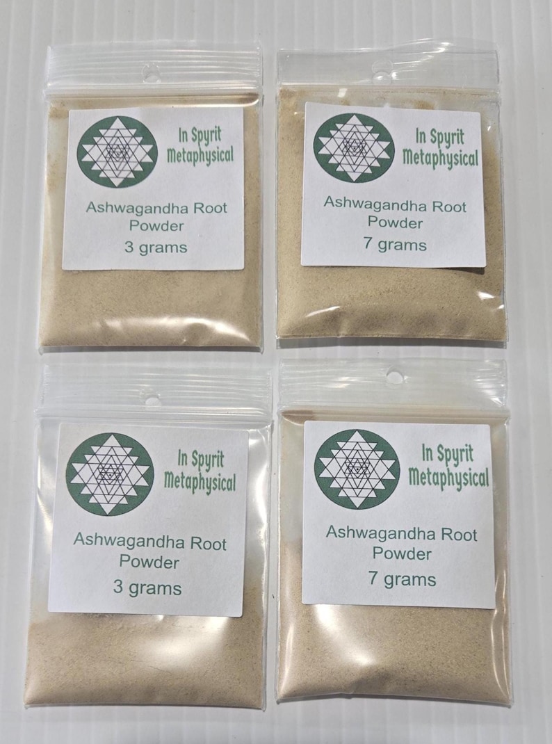 A professional display of Ashwagandha Root Powder from InSpyrit Metaphysical, featuring multiple clear bags in various sizes against a white background. The labels clearly show the sacred geometry logo and the botanical name Withania Somnifera, highlighting the fine, tan herbal powder.