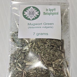 Close-up of a clear resealable bag containing 7 grams of dried Mugwort Green (Artemisia vulgaris). The label features the InSpyrit Metaphysical Sri Yantra sacred geometry logo, representing the union of Divine Masculine and Feminine.
