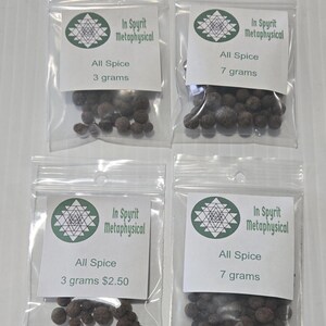 Four small, clear bags of Allspice Berries from InSpryitMetaphysical arranged on a white surface. Two bags contain 3 grams and two bags contain 7 grams of whole, dark brown dried berries. The white circular labels feature the green and black shop logo and the product weight.