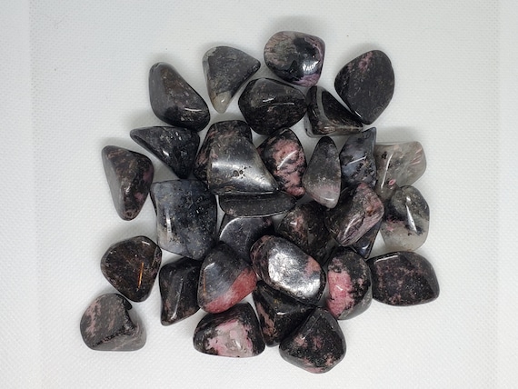 Rhodonite is a powerful and loving stone that embodies the essence of emotional healing, self-love, and compassion.