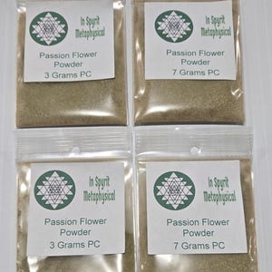 May include: Four small, clear plastic pouches filled with a light brown powder. Each pouch has a white label with green text and a geometric design. The labels read "In Spyrit Metaphysical" and "Passion Flower Powder", with weights of 3 and 7 grams.