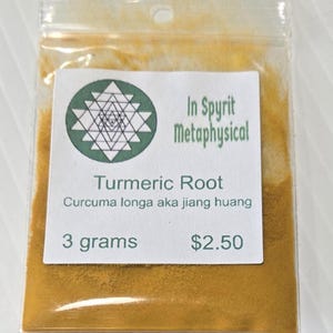 Close-up of a 3 gram bag of InSpyrit Metaphysical Turmeric Powder, showing the fine, vibrant golden-yellow texture of the ground root and the professional white branded label.