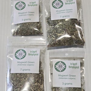Four clear resealable bags of dried Mugwort Green herb in 3g and 7g sizes. Each bag features the InSpyrit Metaphysical logo and botanical name Artemisia vulgaris, showing the silver-green dried leaves ready for ritual use.