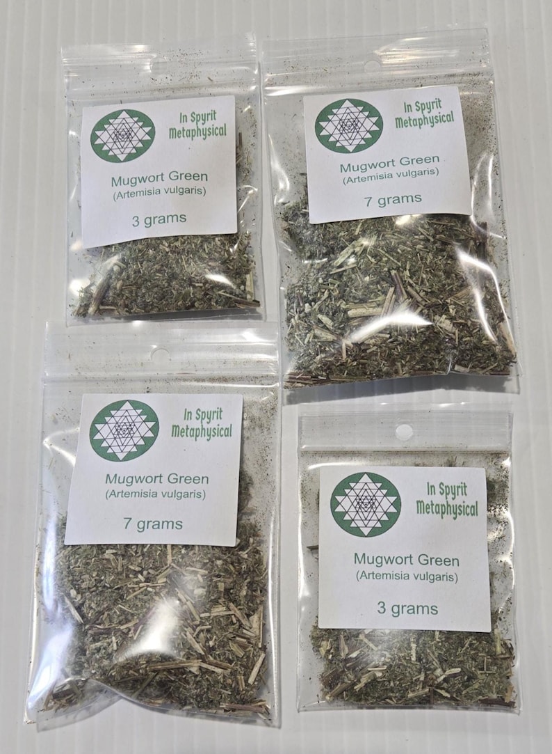 Four clear resealable bags of dried Mugwort Green herb in 3g and 7g sizes. Each bag features the InSpyrit Metaphysical logo and botanical name Artemisia vulgaris, showing the silver-green dried leaves ready for ritual use.