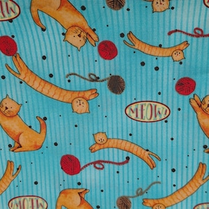 Debbie Mum fun cat and yarn ball fabric piece. Cute orange cats with striped and background. Made for Jo-Ann fabrics.