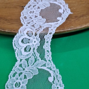 Super light pink tinted lace. Amazing delicate floral scalloped pattern. Sheer romantic piece. Just under 5 yards. Junk journal. Sewing