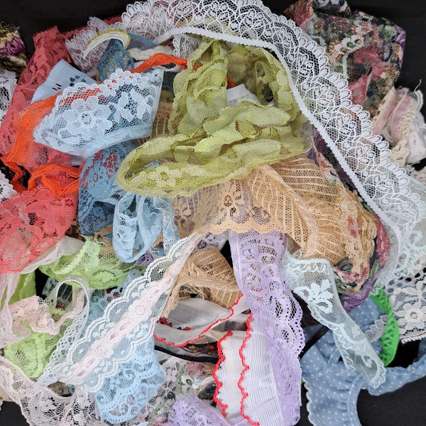 Lot of junk lace and trim little bits. 35 pieces of variety mini junky fun lot. Bear roses bag.
