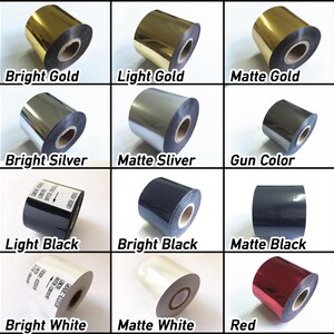May include: A selection of foil rolls in a grid, showcasing colours like gold, silver, black, white, and red. Each roll is labelled with its colour name, including "Bright Gold", "Matte Silver", and "Bright Black".