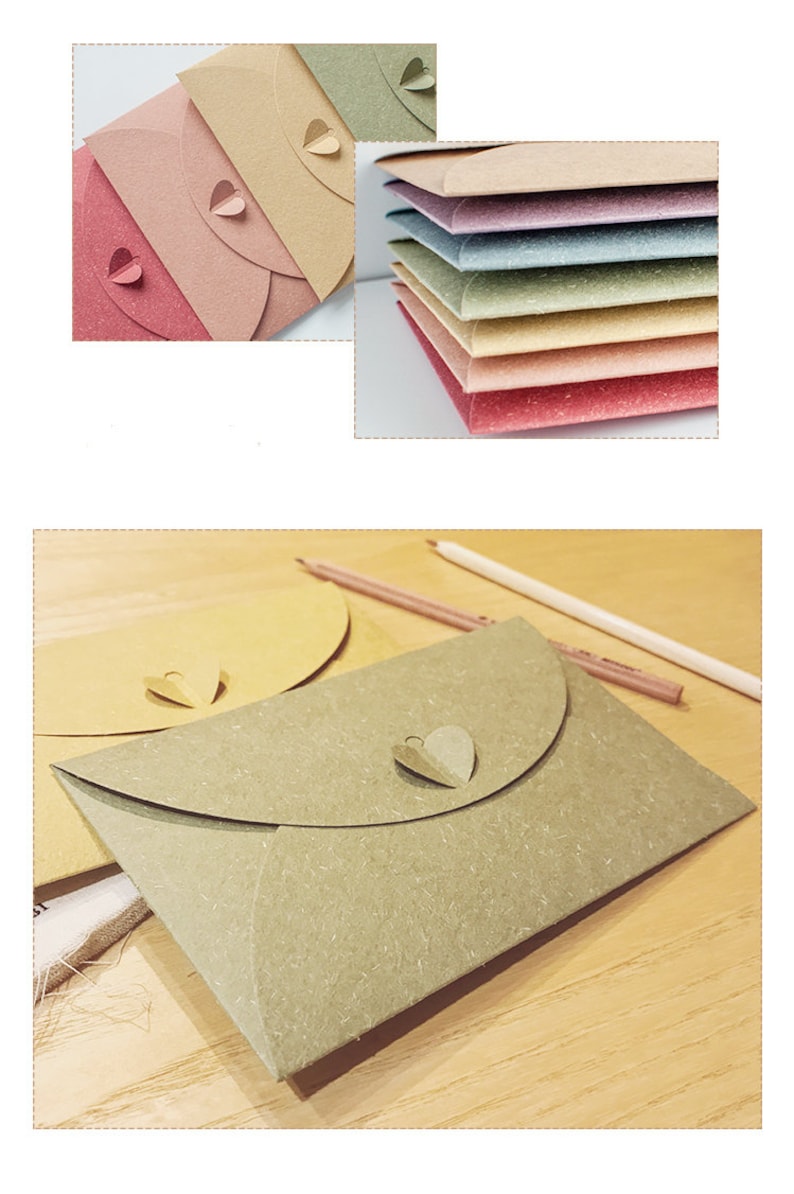 May include: A collection of colorful, heart-shaped closure envelopes in various shades of pink, beige, and green. The envelopes are made of textured paper and are arranged in stacks and individually. Pencils are also visible.