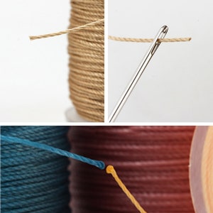 May include: Close-up of a needle threading twine, with a spool of natural-colored twine in the background. The image also shows spools of blue and brown twine. This image is suitable for craft and sewing listings.