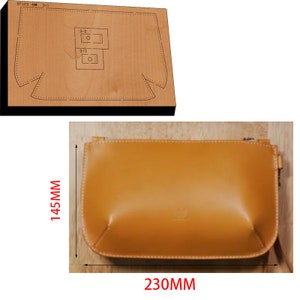 May include: A tan leather handbag with a rectangular shape, measuring 230mm in length and 145mm in height. The image also shows a wooden die-cut template with the bag's outline and text "XF123 # 3-1".