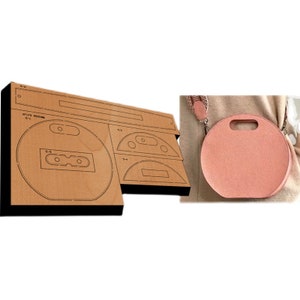 May include: A laser-cut cardboard boombox template and a round, peach-colored crossbody bag with a handle. The boombox template is brown and has cut-out details. The bag has a strap and a handle.
