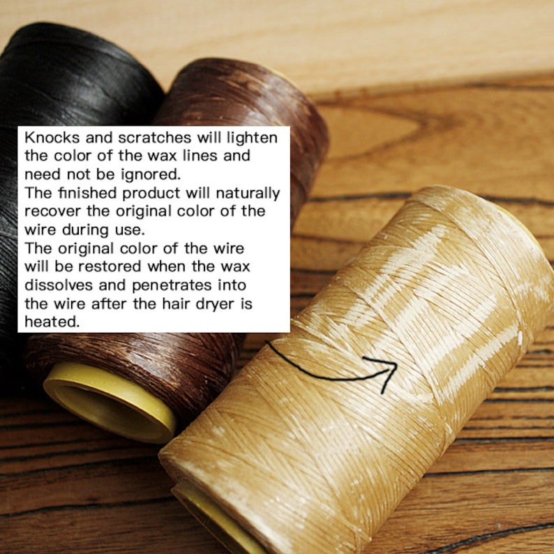May include: Close-up of three spools of waxed thread in black, brown, and tan. The tan spool is in focus, showing the texture of the thread. Text in the image explains how scratches will lighten the color of the wax lines.