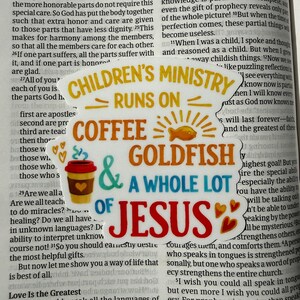 May include: A sticker with the text "CHILDREN'S MINISTRY RUNS ON COFFEE & GOLDFISH & A WHOLE LOT OF JESUS." The sticker features a coffee cup, a goldfish, and hearts.
