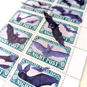 May include: Sheet of stamps featuring illustrations of bats in various poses. Each stamp has a teal border with the words "NIGHT POST" and "BAT DELIVERY POSTAL SERVICE". The bats are depicted in shades of purple and black.