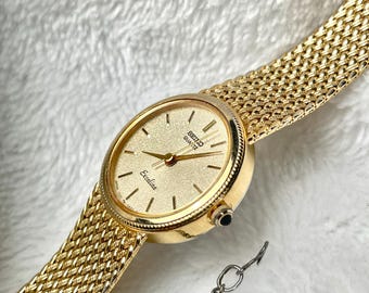 SEIKO　Rivoli ゴールド 腕時計 Gold Tone Seiko Asymmetrical Rivoli Half Moon Watch For