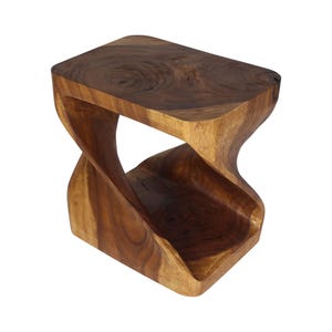 May include: A dark brown wooden side table featuring a smooth rectangular top and a solid base connected by a single, continuous, twisted support structure that creates an open, hourglass-like silhouette with visible natural wood grain patterns.