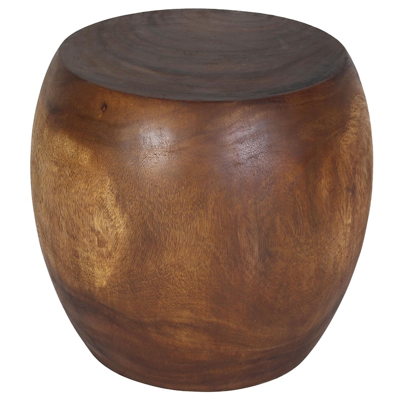 May include: A solid, dark brown wooden stool with a rounded, barrel-like shape. The top surface is a darker shade of brown than the sides, and the wood grain is visible throughout. This decorative stool is a functional and stylish piece of furniture.
