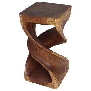 May include: A dark brown wooden stool with a unique twisted design. The stool has a square top and a wide base.