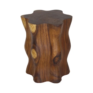 May include: A dark brown wooden stool with a smooth, polished finish. The stool features a distinct, undulating, flower-like shape with six rounded lobes along its perimeter. The wood grain is visible, showcasing natural knots and varied brown tones.