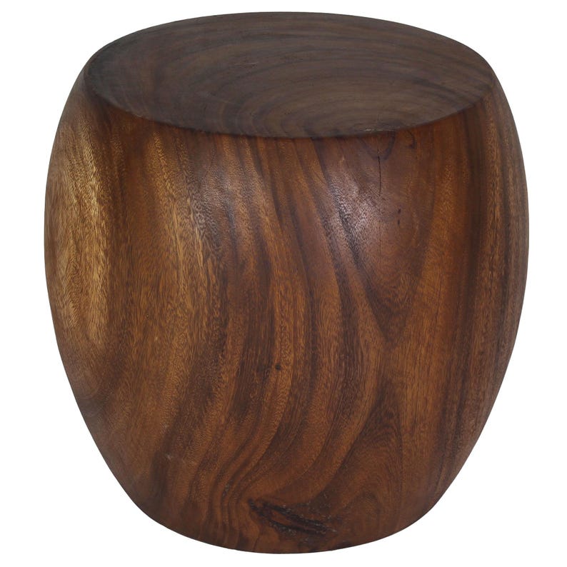 May include: A solid, dark brown wooden stool with a rounded, barrel-like shape. The wood grain is visible, adding texture and visual interest to the piece. The stool has a flat top and a slightly wider base.