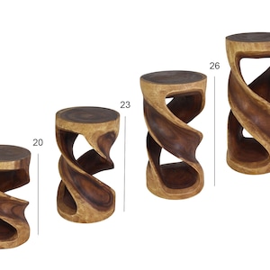 May include: Four wooden accent stools with a unique, twisted design. The stools vary in height, with the tallest measuring 30 inches and the shortest at 20 inches. Each stool features a dark brown top and a lighter brown, swirling base, showcasing the natural wood grain.