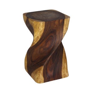 May include: A solid wood stool featuring a distinct twisted hourglass shape. The piece displays a natural wood grain pattern with contrasting dark brown and light tan tones, showcasing a smooth, polished finish on its vertical, spiraling structure.
