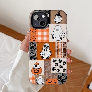 May include: A patchwork-style phone case featuring Halloween-themed designs. The case includes images of ghosts, bats, pumpkins, and spiderwebs in orange, black, and white. The case is designed to fit a smartphone.