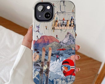 May include: A colorful phone case with a collage of winter sports imagery, including skiers, a ski lift, and a red car. The case features a ski slope with a mountain in the background. The case has a camera lens cutout and a white background.