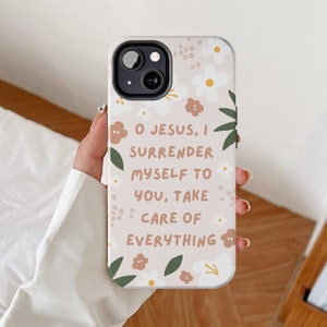 May include: A pink phone case with a floral design and the text "O Jesus, I surrender myself to you, take care of everything".