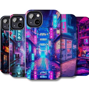 May include: A collection of phone cases featuring a vibrant, neon-lit cityscape design. The artwork showcases a Japanese-inspired street scene with glowing signs, lanterns, and reflections on wet pavement. The color palette includes shades of blue, purple, and pink.