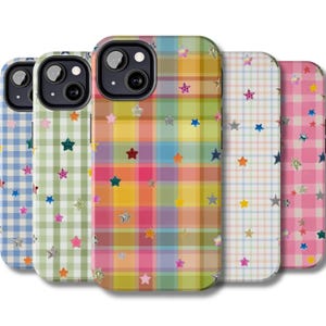 May include: Five phone cases with vibrant plaid designs and star decorations. The cases display a range of colours, such as blue, green, yellow, pink, and orange, with silver and glittery star embellishments.