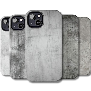 Puede incluir: Cuatro fundas para teléfono diferentes con un diseño de hormigón gris. Las fundas tienen todas la misma forma y tamaño, pero presentan diferentes patrones de gris y blanco.