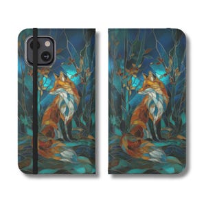 May include: A phone case featuring a stained glass style illustration of an orange fox sitting in a dark blue forest. The design includes a black elastic strap across the front cover and a camera cutout on the upper left corner of the case.