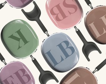 May include: A set of nine oval-shaped frying pans with different colored handles and letters on the front. The letters are "EB", "LB", "ILB", "SB", "K", "LL", "E", "SP", and "I".