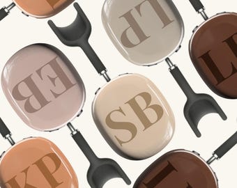 May include: A set of eight oval-shaped frying pans with black handles. Each pan has a different two-letter monogram in brown on a light brown, beige, or dark brown background.